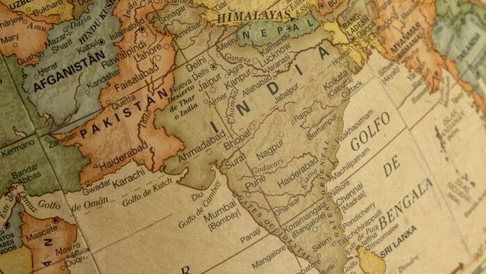 Close-up view of a vintage globe highlighting South Asia, including India and surrounding countries.